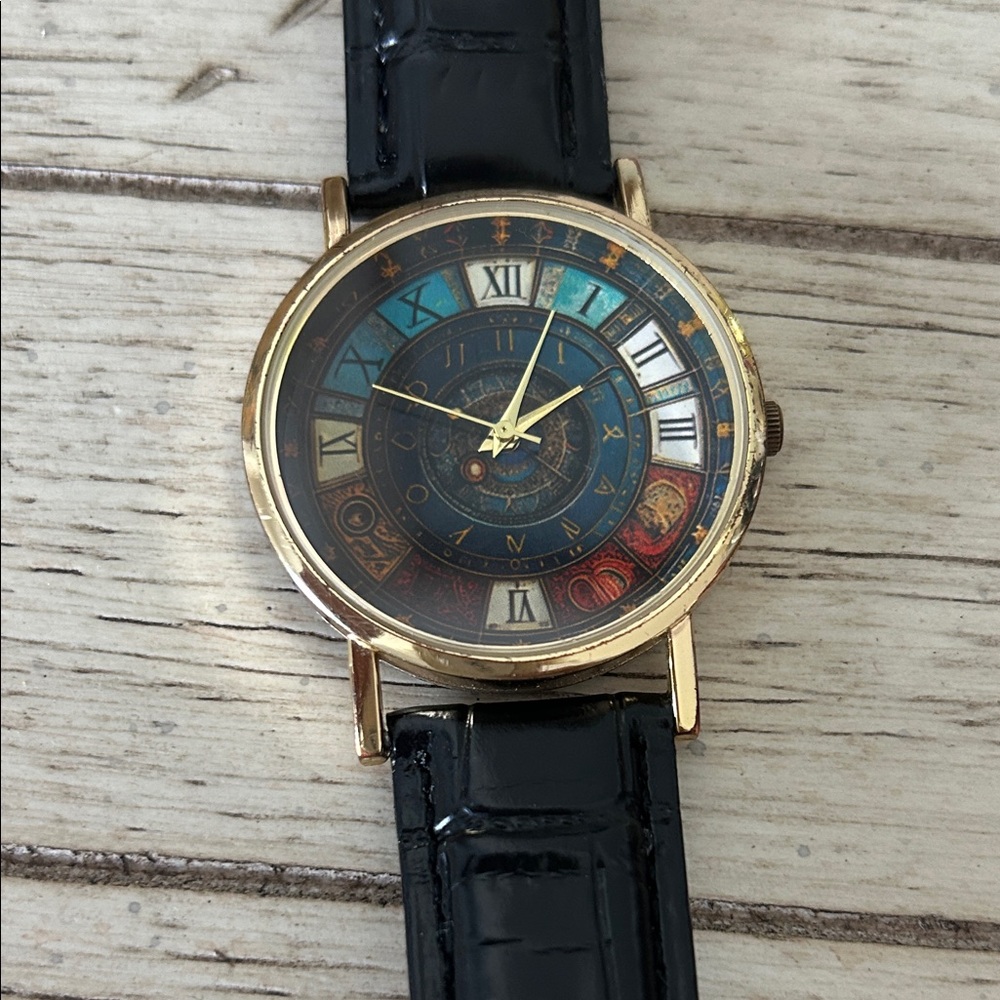 Elegant Gold Watch with Black and Tan Strap